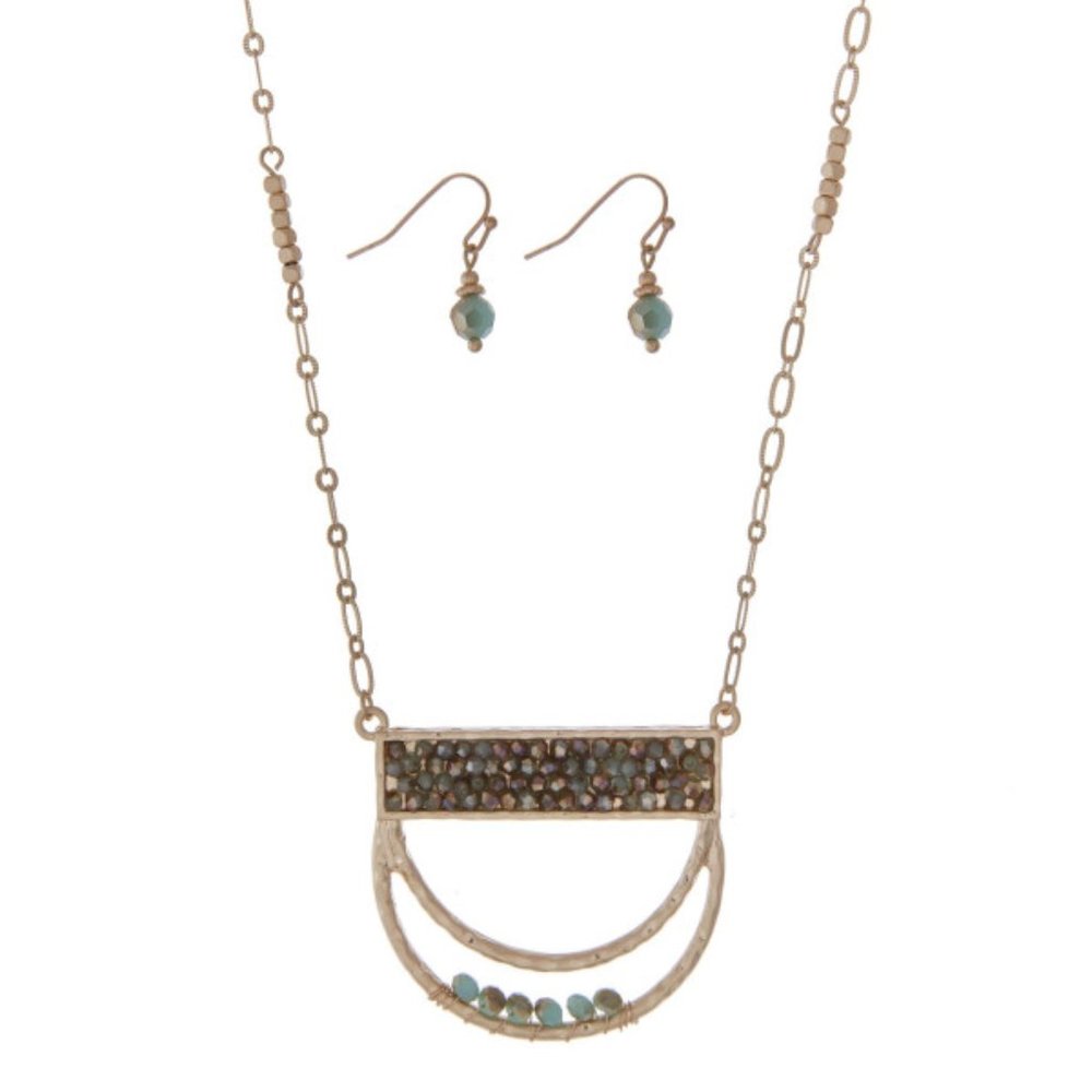 Gold tone necklace set a half circle pendant accented with turquoise beads